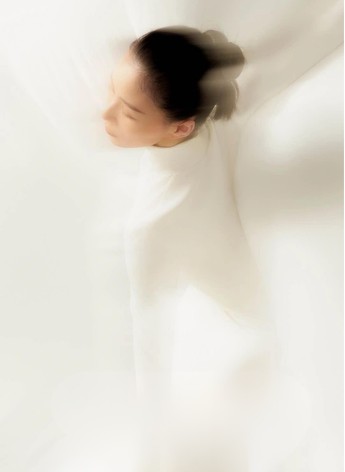 Softly blurred portrait in white research reference