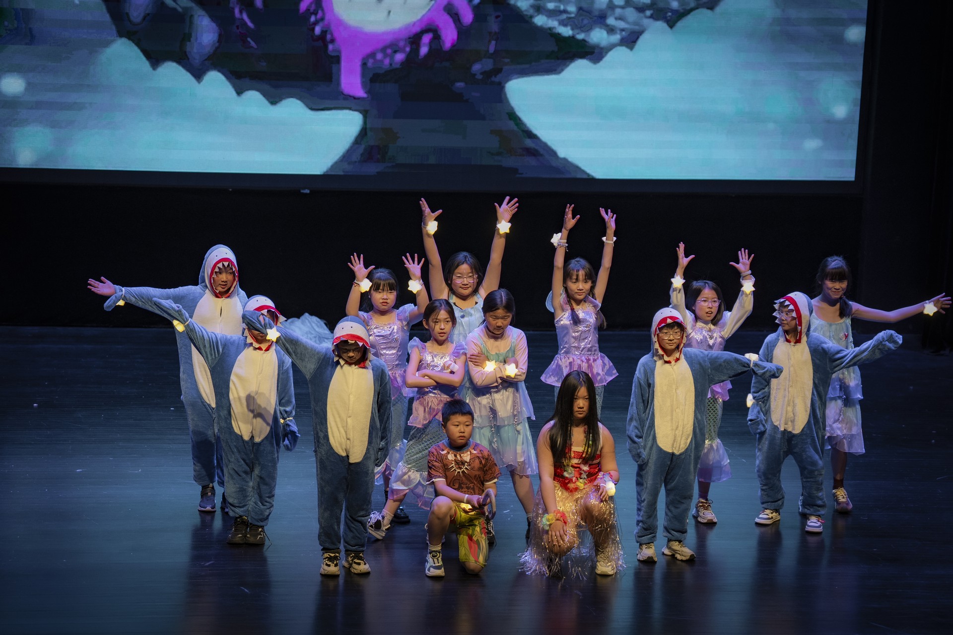 Children rehearsing on stage